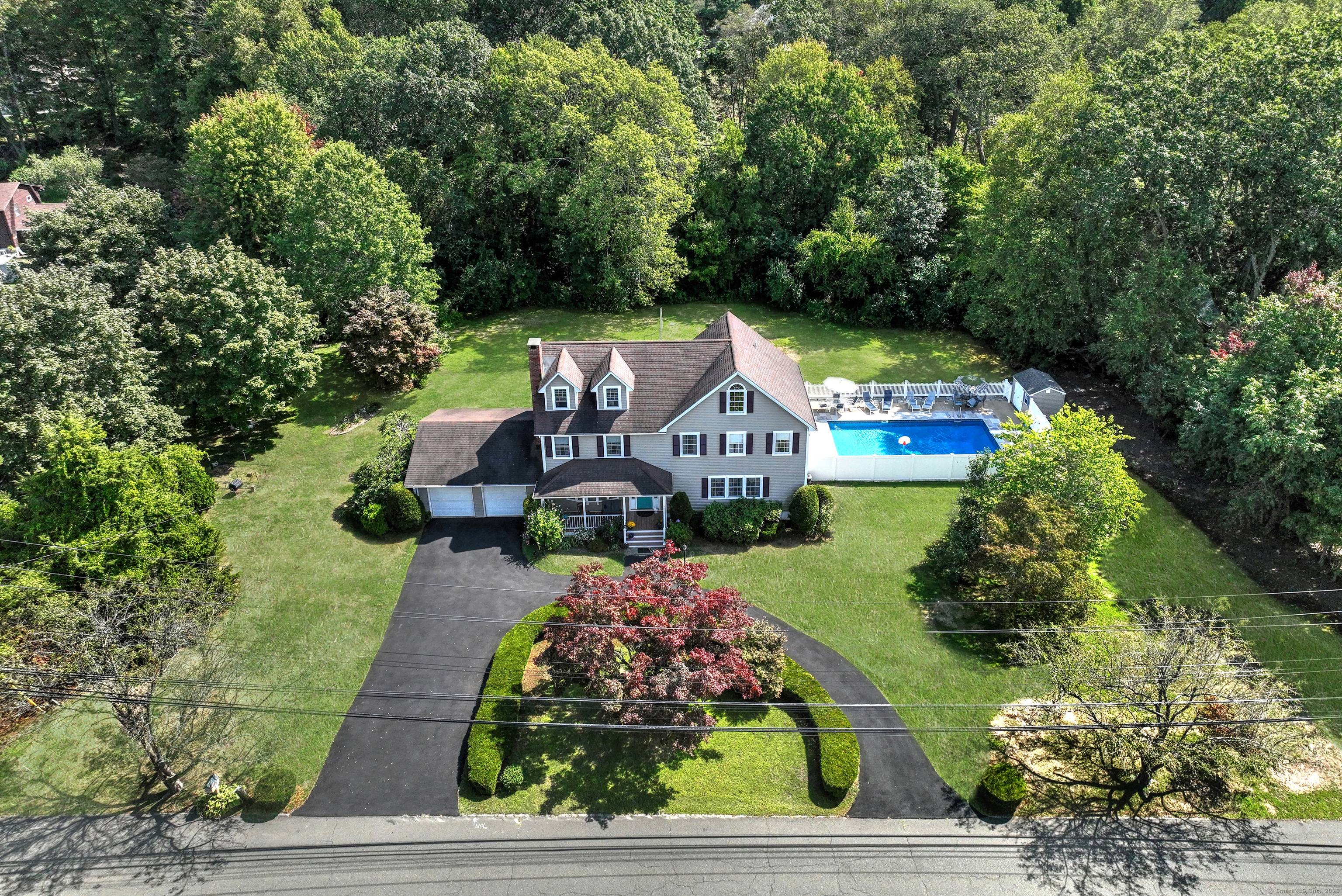 Welcome home to this charming 4 bedroom Colonial located at 161 Herbert Street beautifully situated on a circular drive on over a private acre.