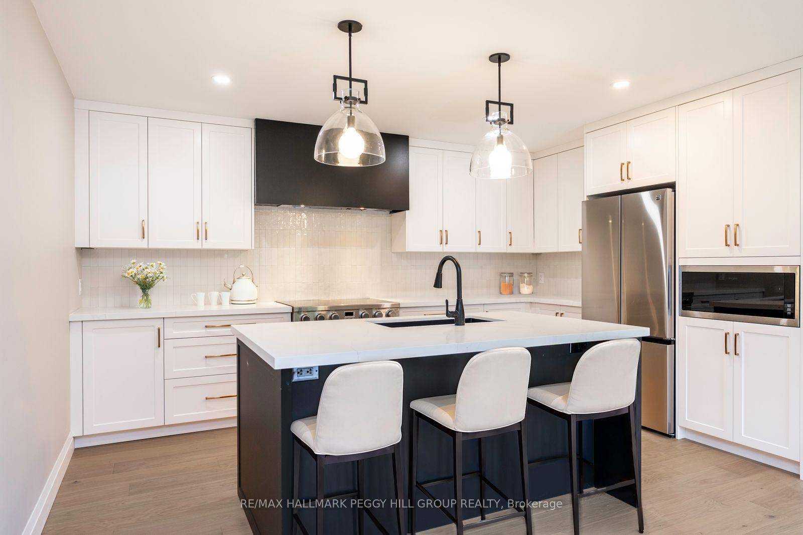 MODERN ELEGANCE MEETS NATURAL BEAUTY IN THIS FULLY RENOVATED MIDHURST HAVEN FEATURING A DESIGNER KITCHEN, IN LAW SUITE POTENTIAL, amp ; EXPANSIVE OUTDOOR LIVING !