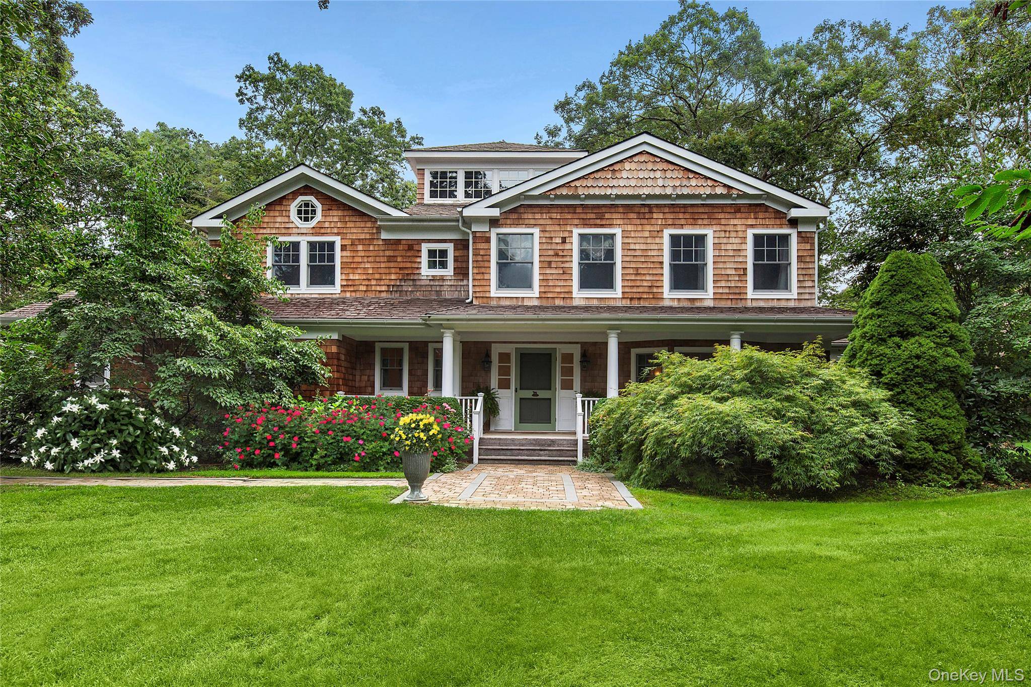 Set on 1. 33 acres at the end of coveted Cedar Lane, this fully renovated Post Modern offers both serenity and privacy amidst lush landscaping and gorgeous perennial gardens.