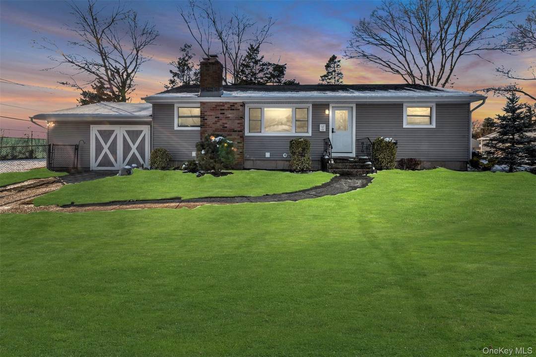 Welcome to this lovely three bedroom ranch in Centereach, located on a peaceful corner lot at the end of a dead end street.