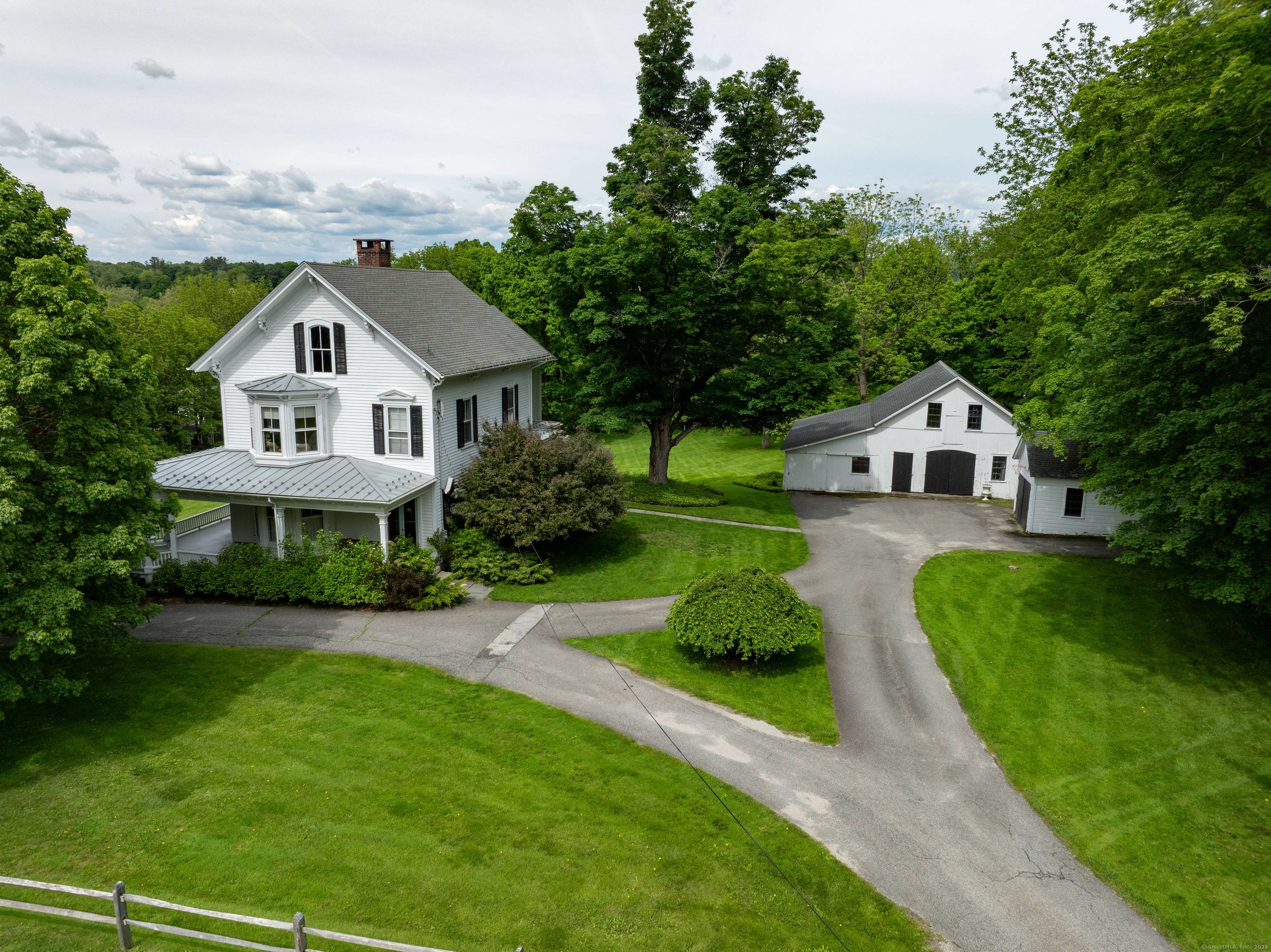 This distinguished 1880s Victorian residence in the heart of Lakeville village offers a masterful blend of period craftsmanship and contemporary luxury on 2.