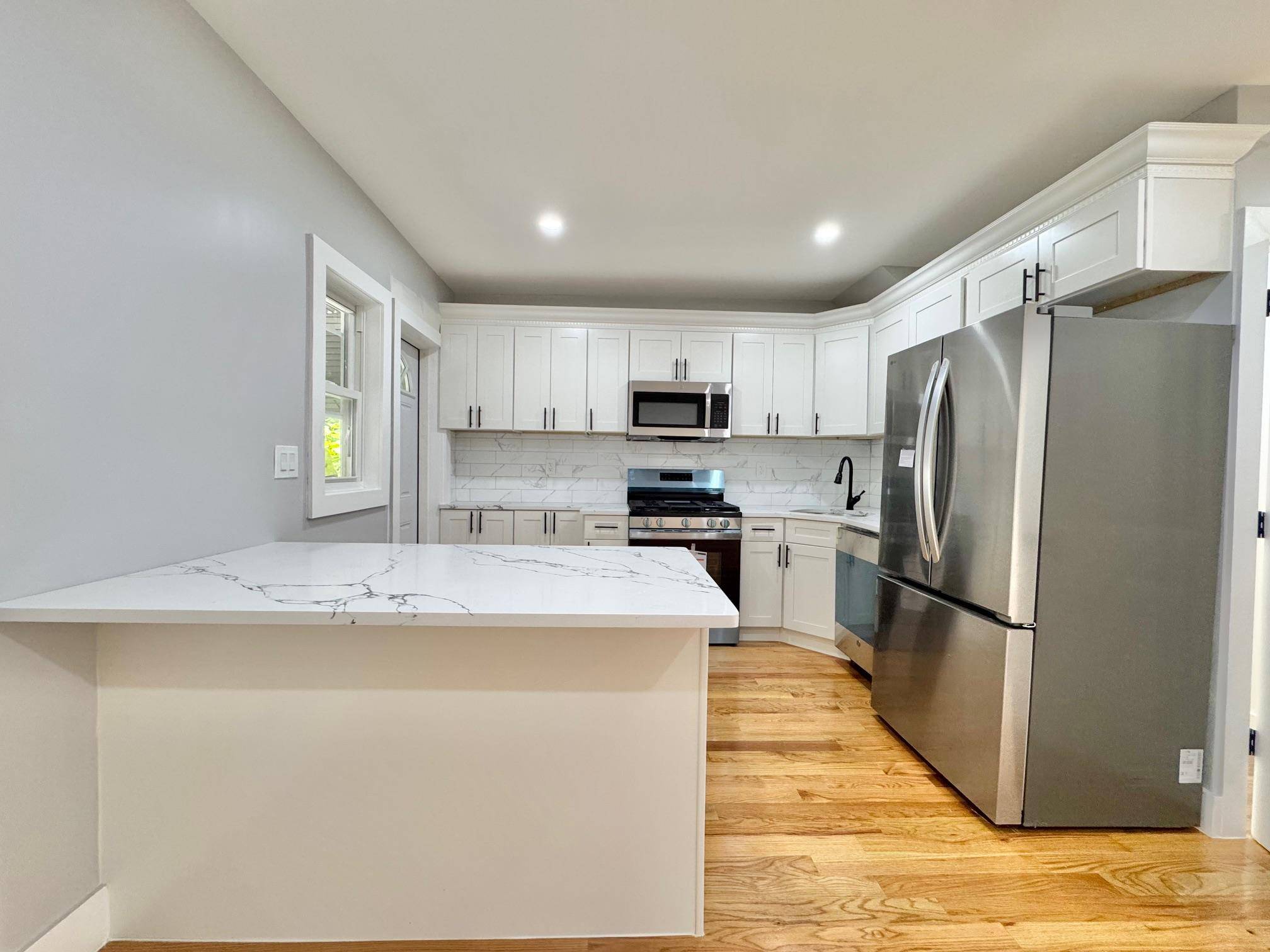 Welcome to this beautifully renovated 3 bedroom, 3 bathroom home that seamlessly blends modern design with timeless charm.
