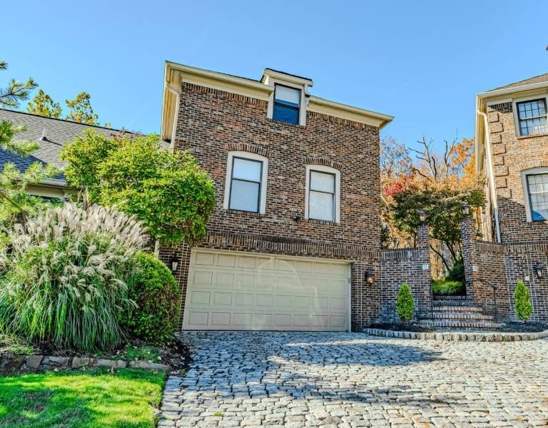 Welcome to this beautifully upgraded end unit townhouse in the highly desirable community of Florham on Fairways, just steps from the scenic Brook Lake Country Club.