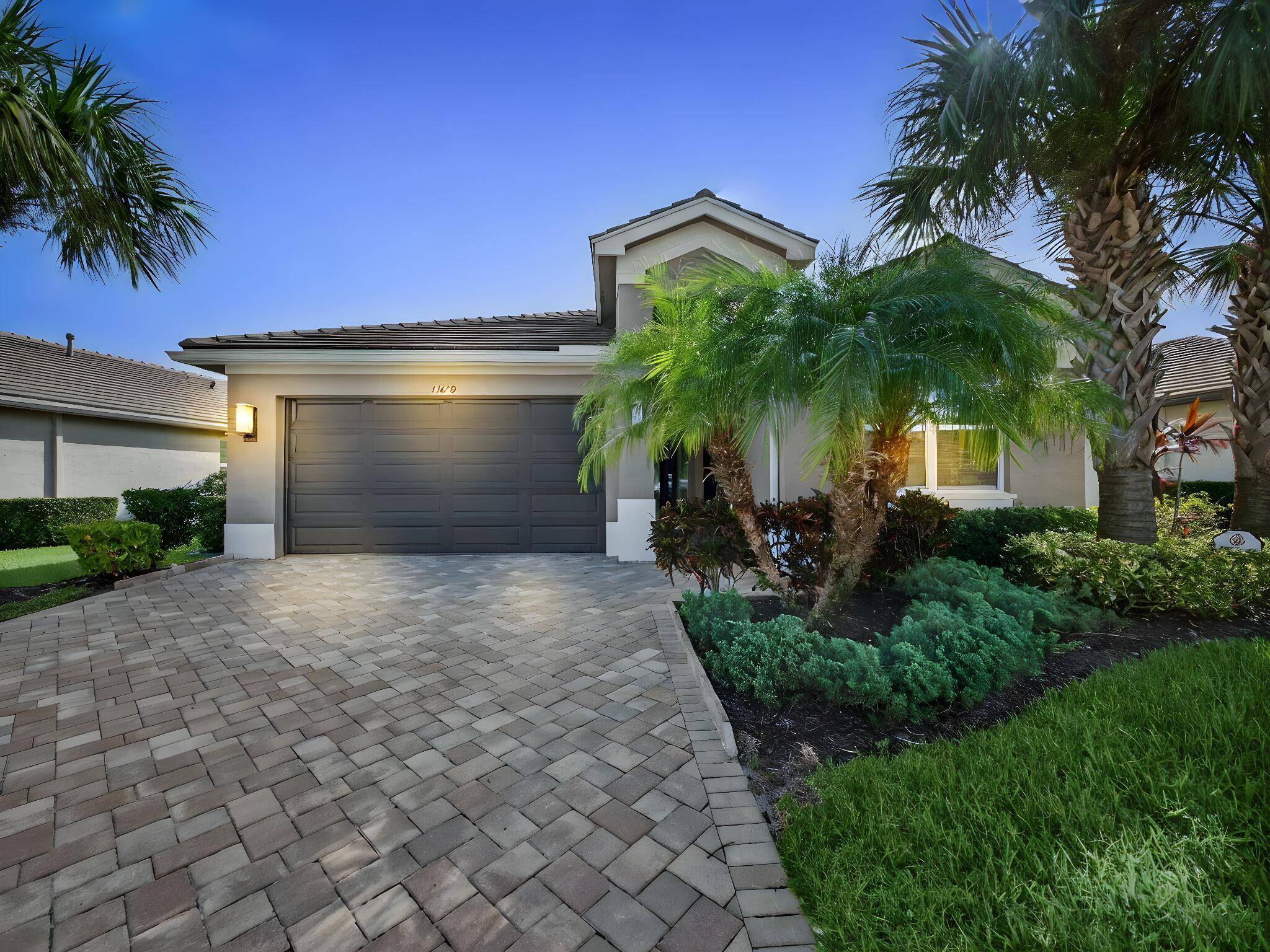 Welcome to this impeccable and beautifully upgraded 2 Bedroom Den, 2 Bathroom lakefront home in the highly desirable 55 community of Valencia Cay at Riverland.