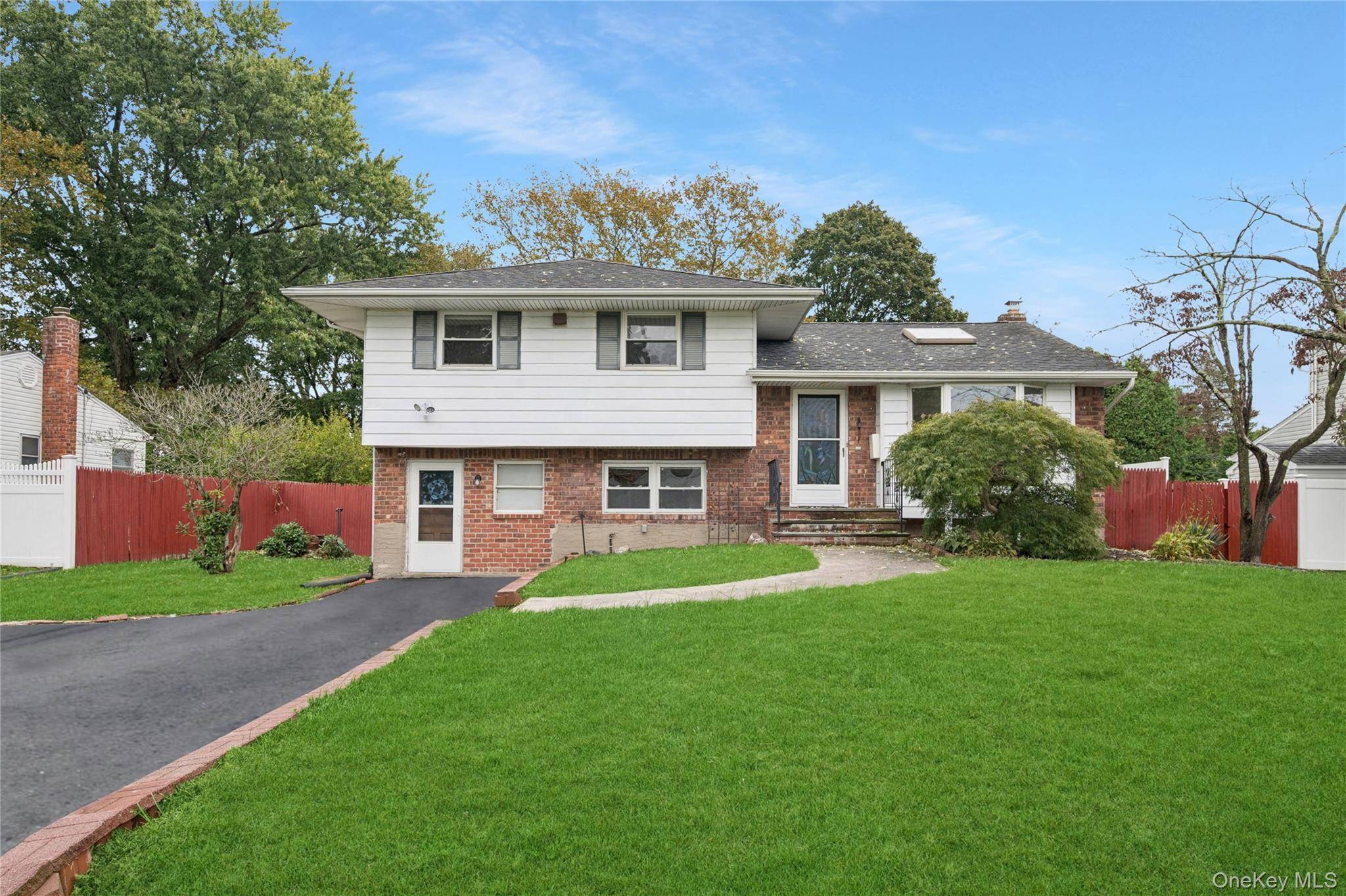 Nestled on an expansive. 28 acre lot on a quiet residential street, this four level split offers 3 bedrooms, 1.