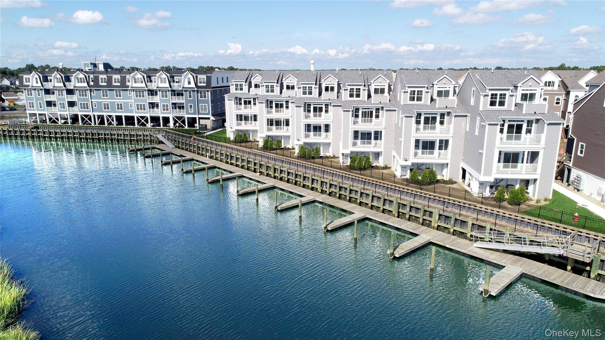 Welcome to 535 Marina Pointe Drive, a thoughtfully designed 2 bedroom, 2 bath condo suite offering 1, 241 square feet of stylish, open concept living.