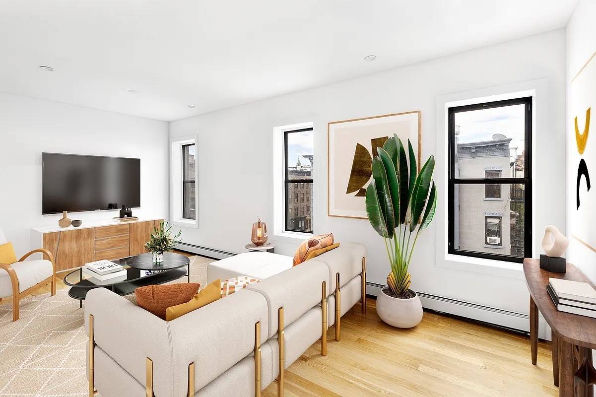 Welcome to 3, a bright and spacious corner 3 bedroom apartment with open chef's kitchen in prime North Park Slope.