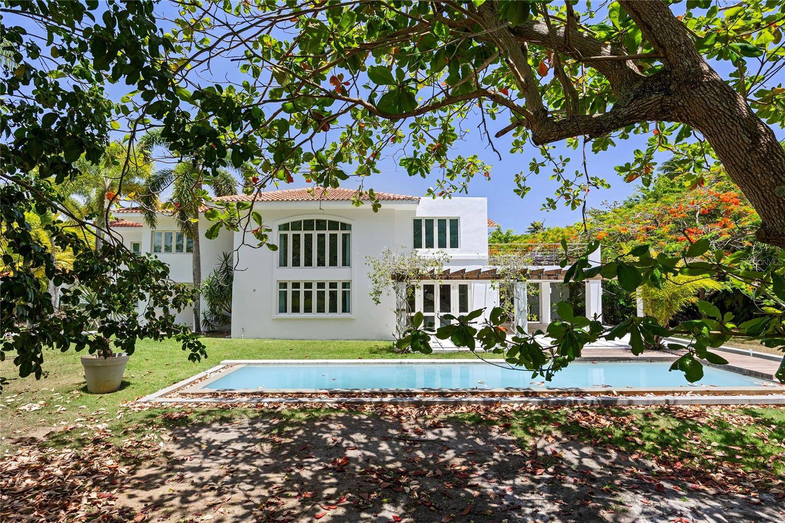 Tucked away at the end of a quiet street in Dorado Beach East, this beautifully maintained residence enjoys a peaceful setting surrounded by nature.