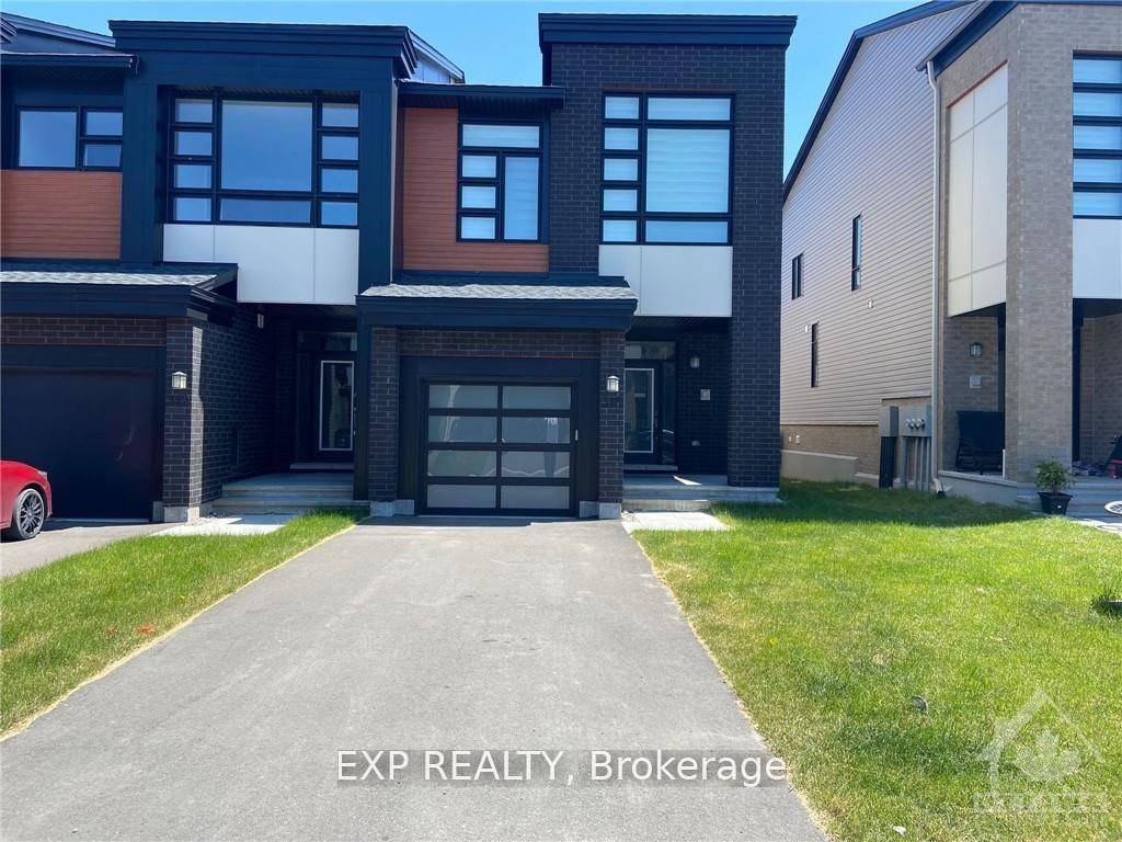 Gorgeous Urbandale end unit townhome in the sought after development of Cowans Grove in Findlay Creek, situated on a premium un shared driveway lot.