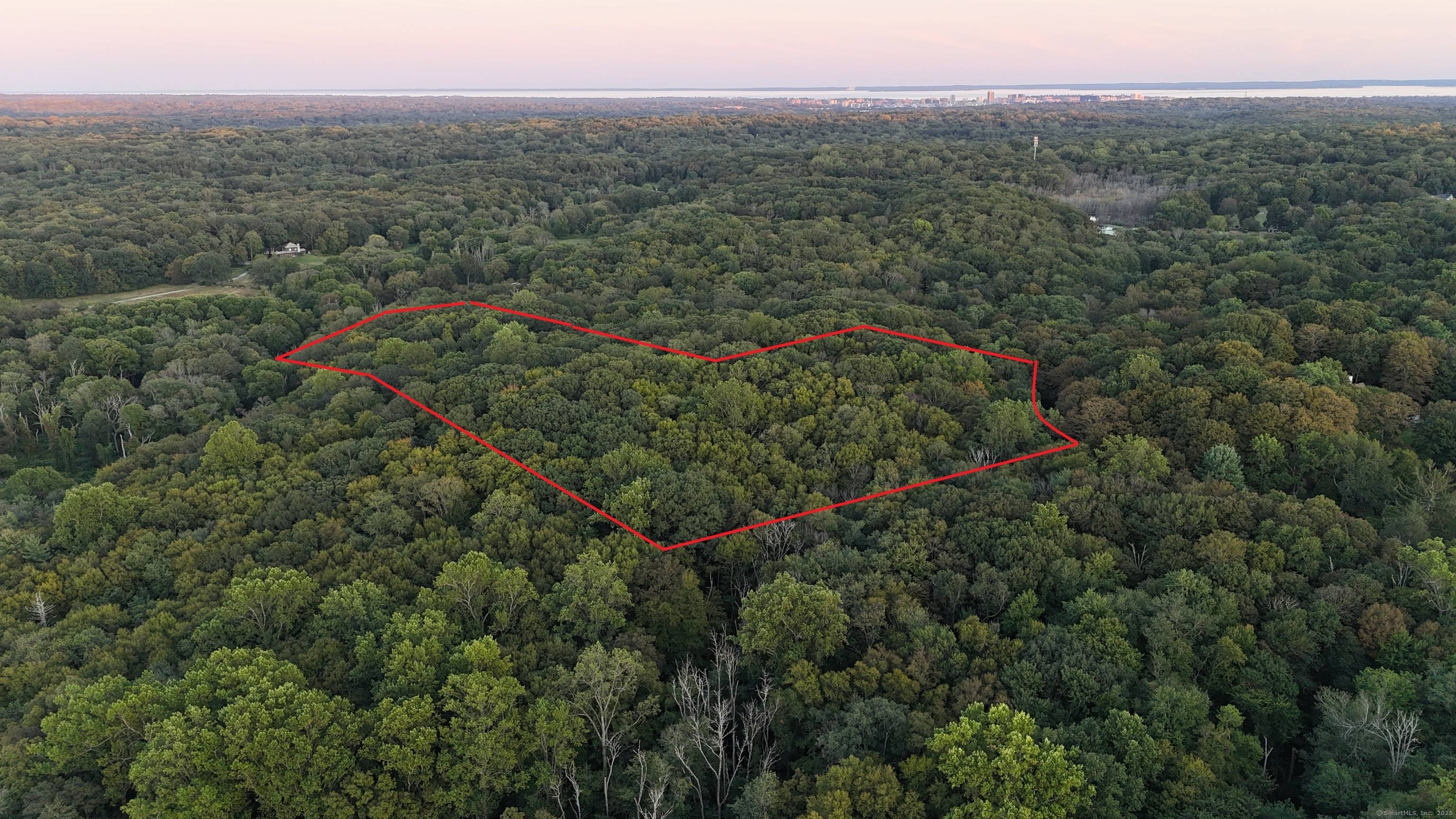 Rare Opportunity 14 Acres on the Greenwich Stamford Border Bordering the 900 acre Mianus River Gorge Preserve, this exceptional 14 acre property offers unmatched privacy and endless potential.