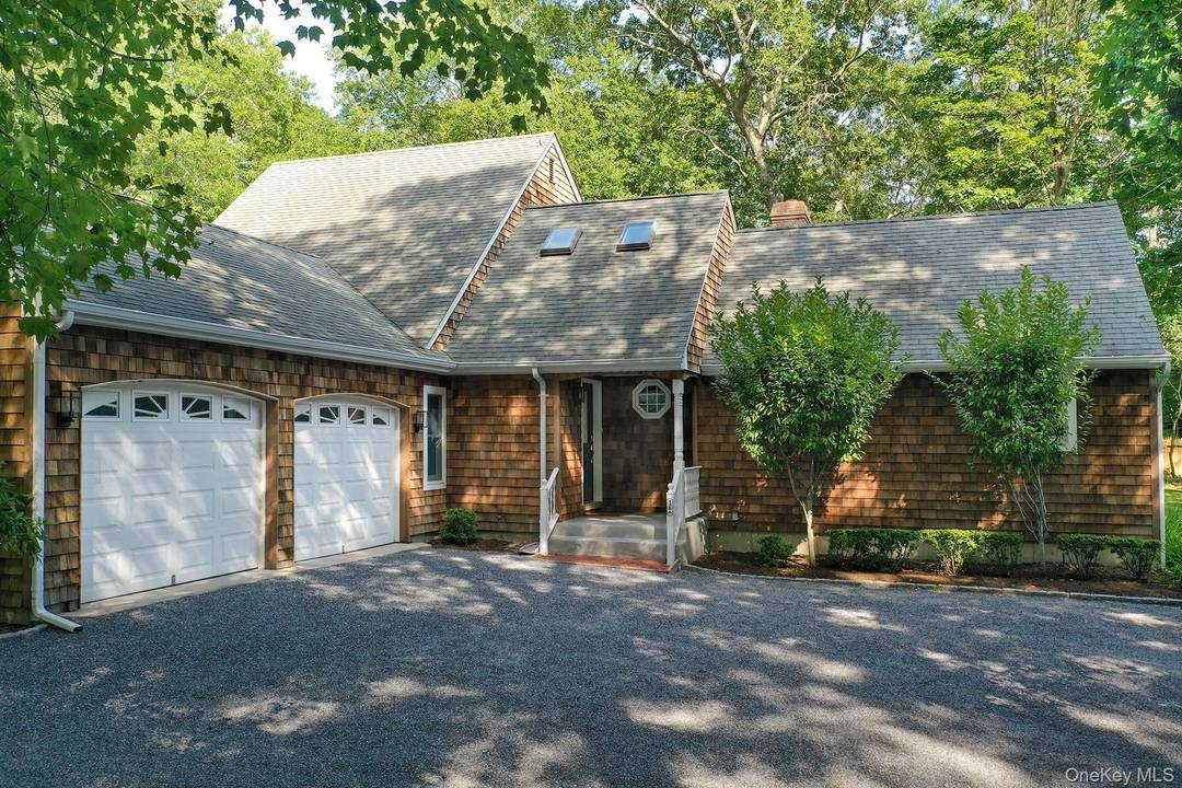 This beautiful shingle style home abutting 2 acres of town owned reserve offers the perfect blend of Hamptons privacy, charm and comfort.