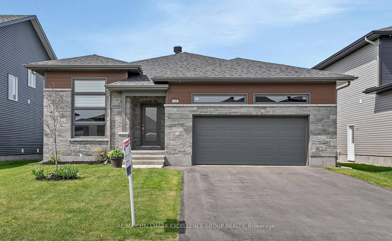 OPEN HOUSE SUNDAY JULY 13TH 2 4PM Welcome to this stunning three bedroom bungalow, offering approximately 1, 700 sq.