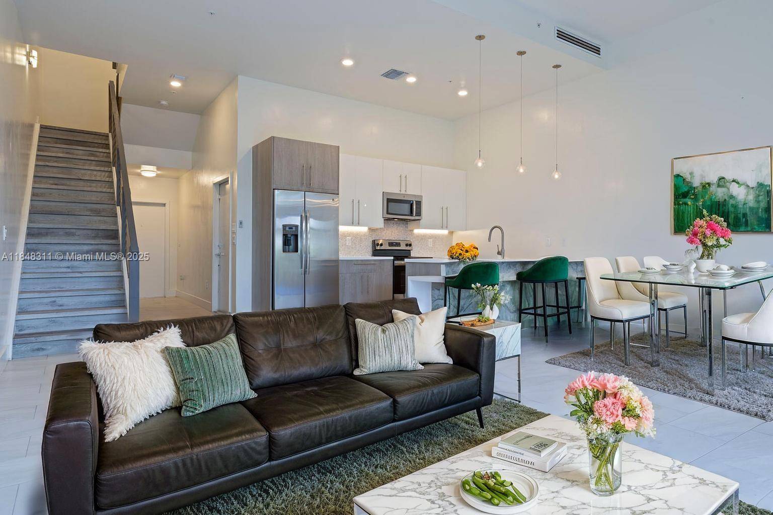 Modern Townhouse in Move In Ready Condition Located in the Gated Community of Strata Plantation.