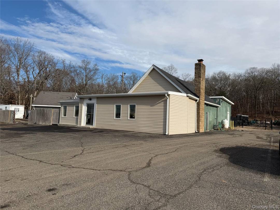 Freestanding office or retail building with work shop.