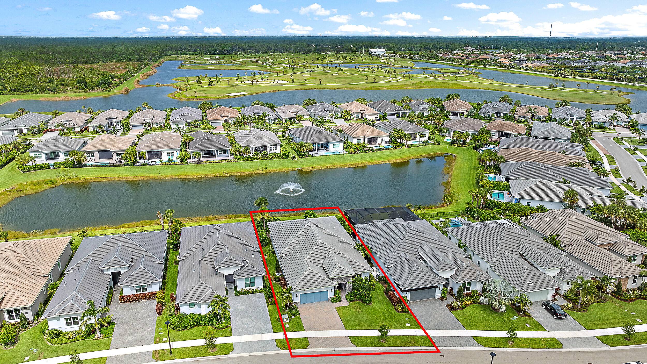 Located in the Tradewinds section of Regency at Avenir, this single story Isabella model with a contemporary elevation offers refined design and serene lakefront living.