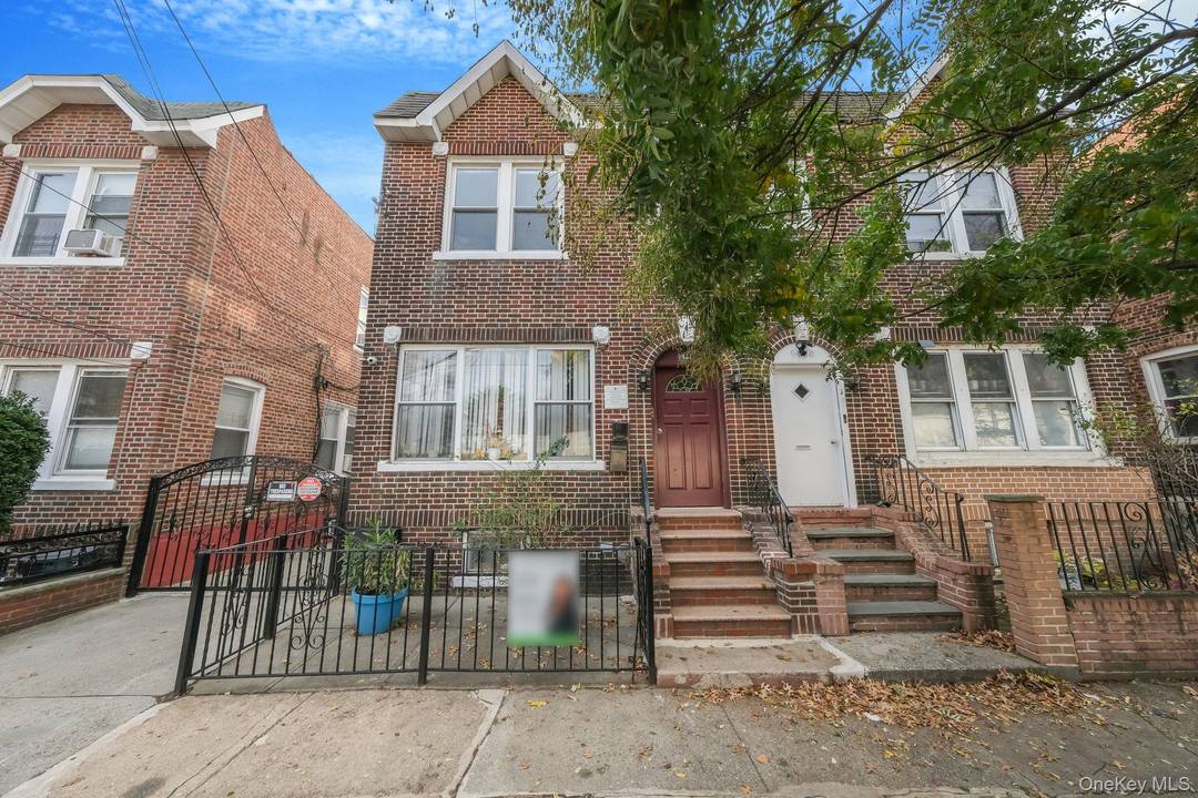 Welcome to 94 32 94th Street, a semi detached brick three family home in Ozone Park.