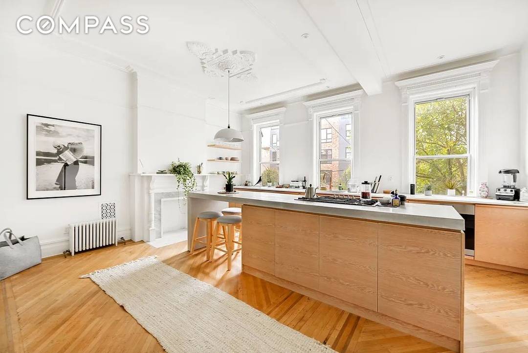 This stunning 20 ft wide, two family home combines wonderfully preserved original details with a perfectly executed, designer renovation.