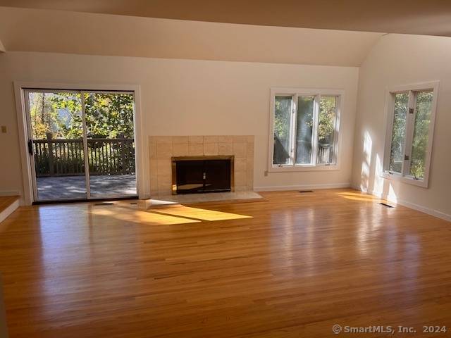 Dramatic Contemporary Colonial with soaring ceilings, hardwood floors, sun drenched large rooms with open floor plan.