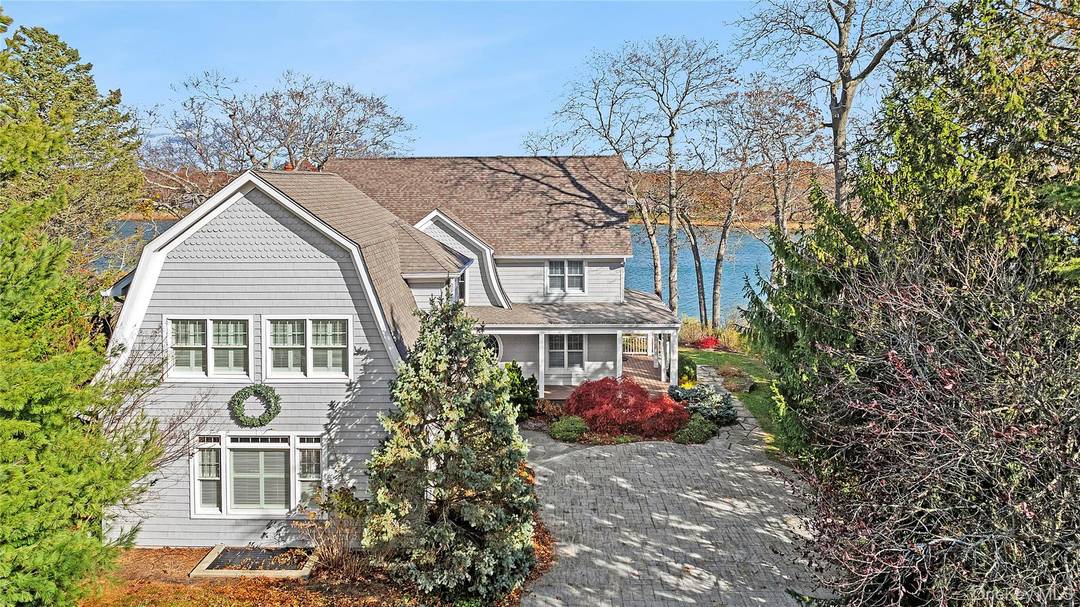 This stunning waterfront estate presents a unique opportunity to create a generational compound, complete with a boater's lifestyle, thanks to its private dock and ample outdoor entertaining space.