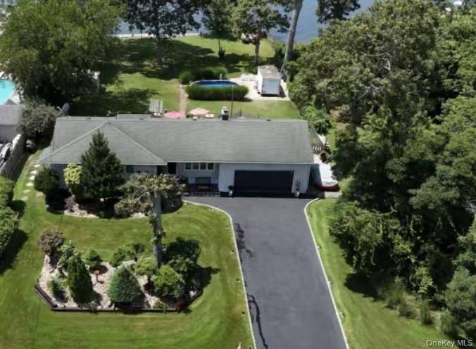 Dream Waterfront Living 3 Bed, 2 Bath with Expansive Views amp ; Endless Potential Welcome to this rare waterfront gem nestled on just shy of a half acre, offering stunning ...