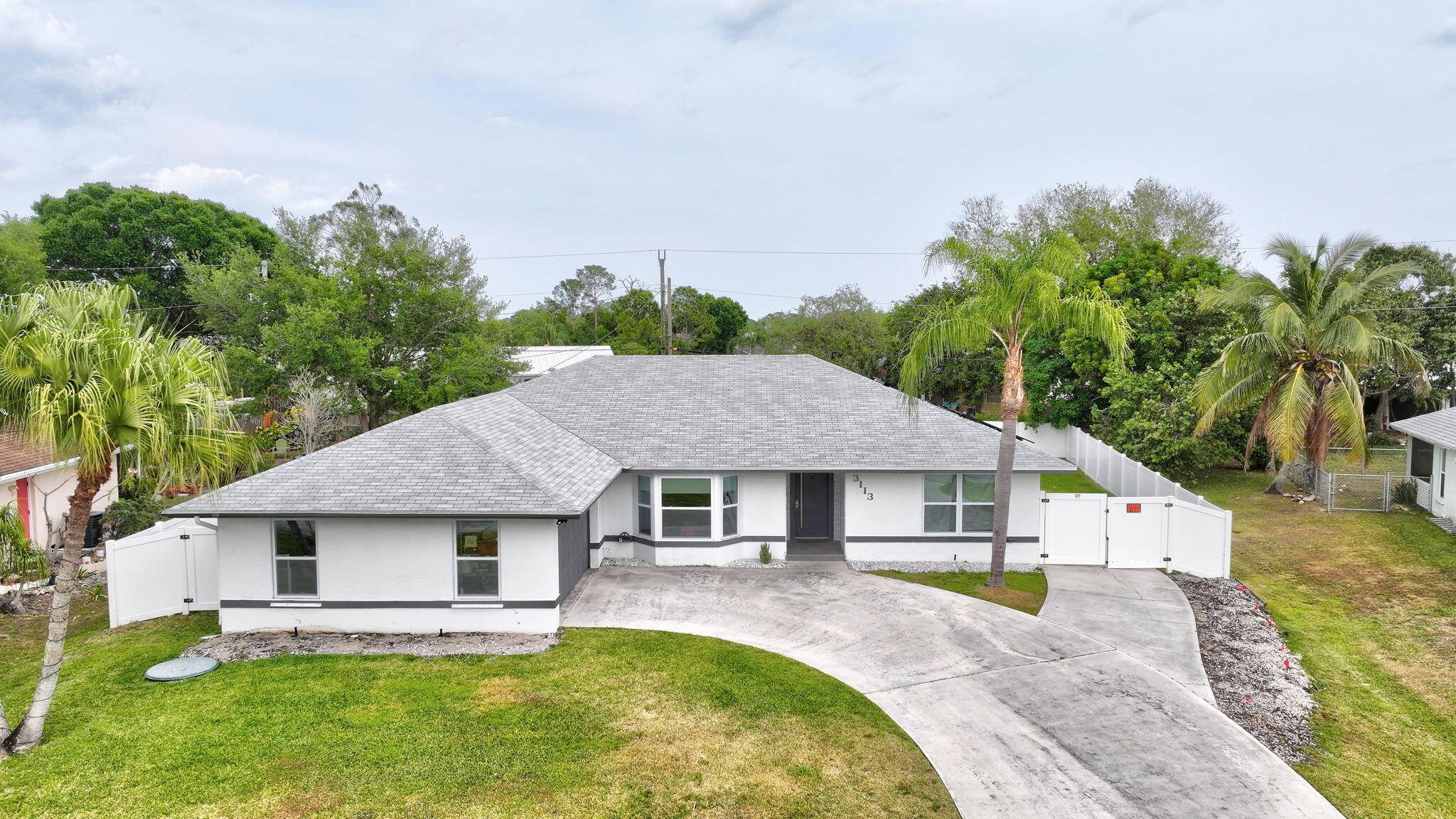 This beautifully renovated pool home is situated on an oversized lot in one the best neighborhoods in PSL.