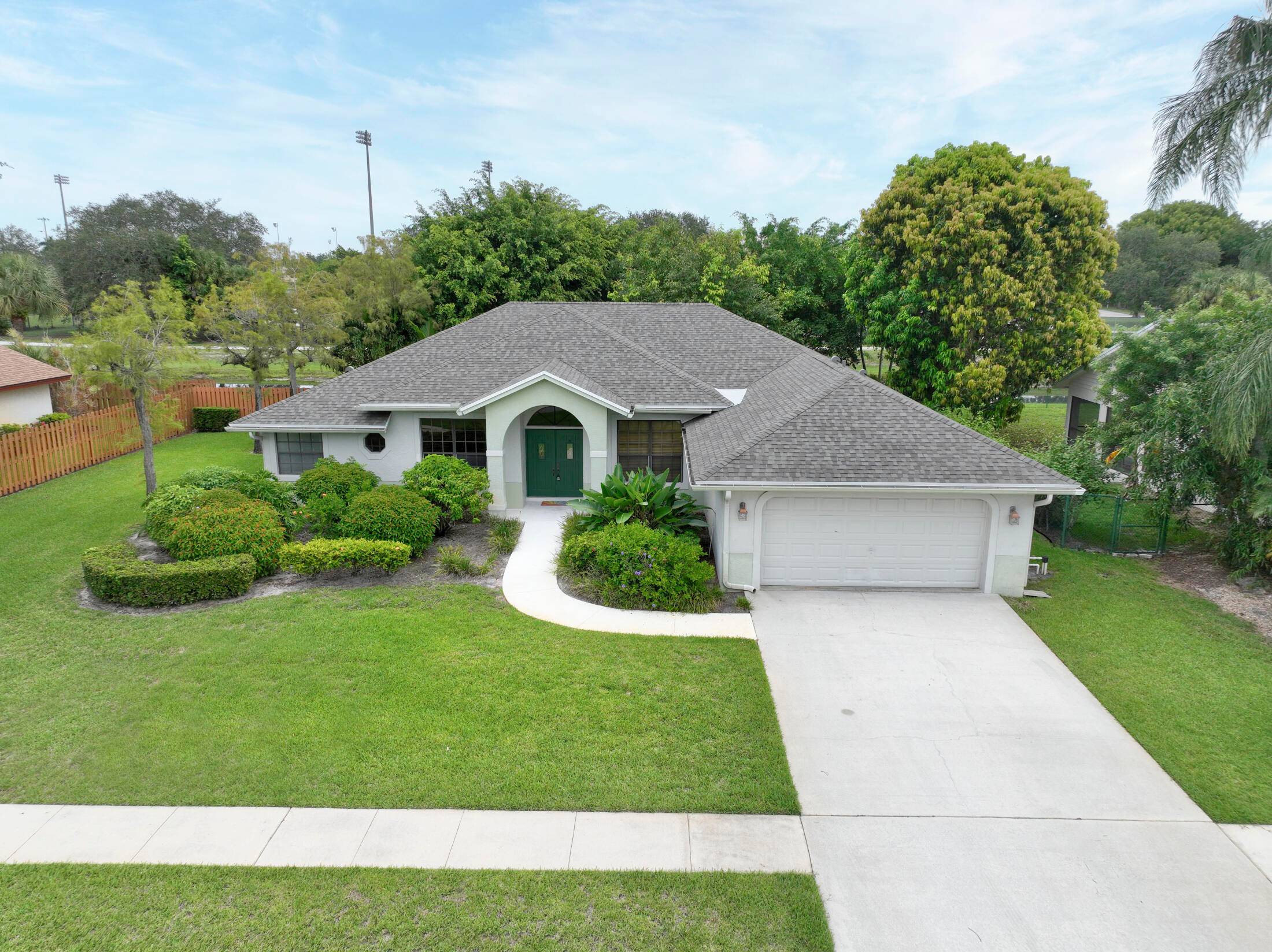 VACANT ESTATE SALE ON THE CANAL NO POOL LARGE SCREENED PATIO, NEXT TO WELLINGTON HIGH SCHOOL, 4 BEDROOMS 2.