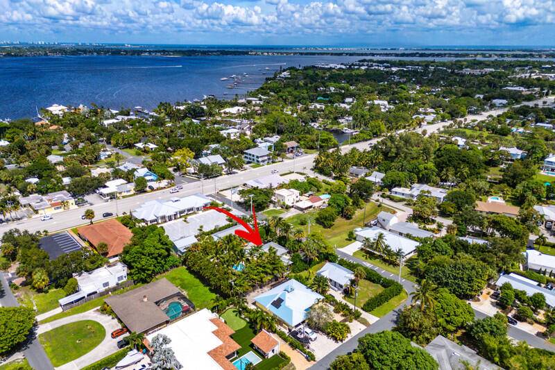 Located in the heart of downtown Stuart, this beautifully updated mid century home offers 3 bed, 2 bath, and sits on over 1 3 of an acre.