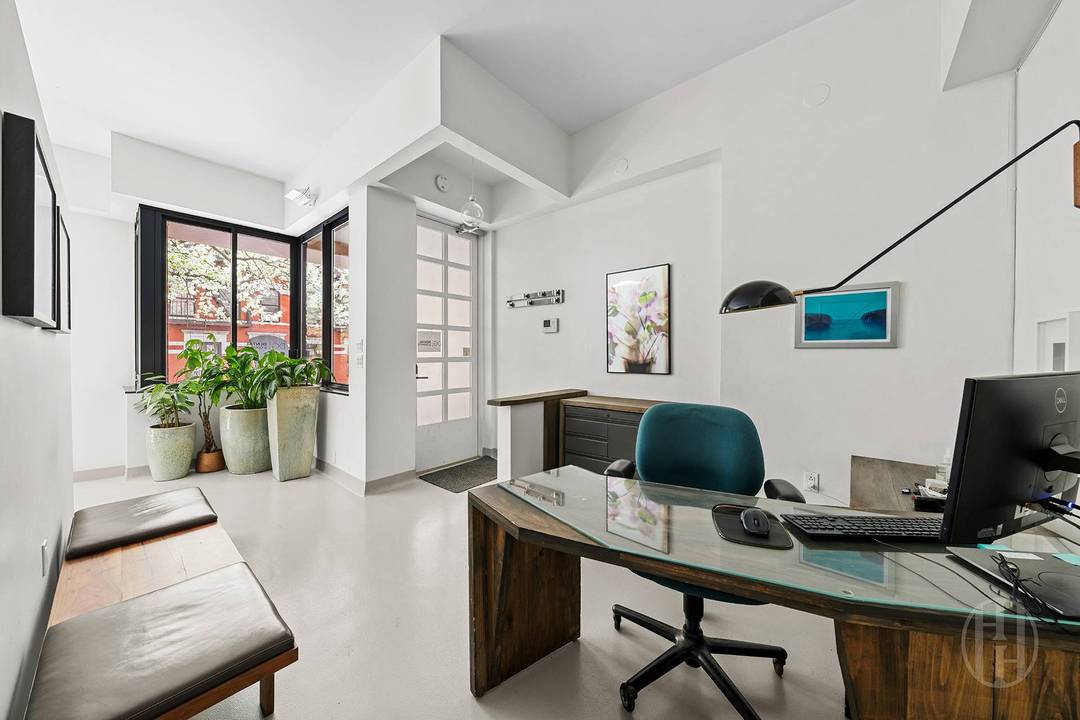 Spectacular Commercial Unit Welcome to Townhouse 1D at 367 West 49th Street a rare and versatile offering within the Worldwide Plaza Condominium.