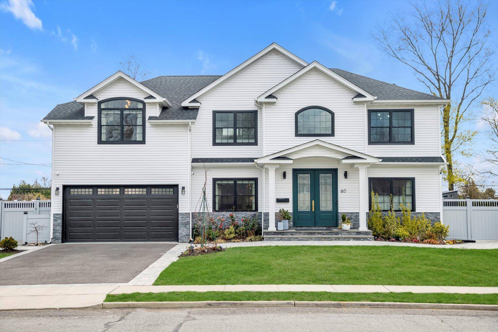 Modern Luxury Meets Timeless Design in East Birchwood School District Zoned for George A Jackson Elementary, Jericho Middle School, and Jericho Senior High School.