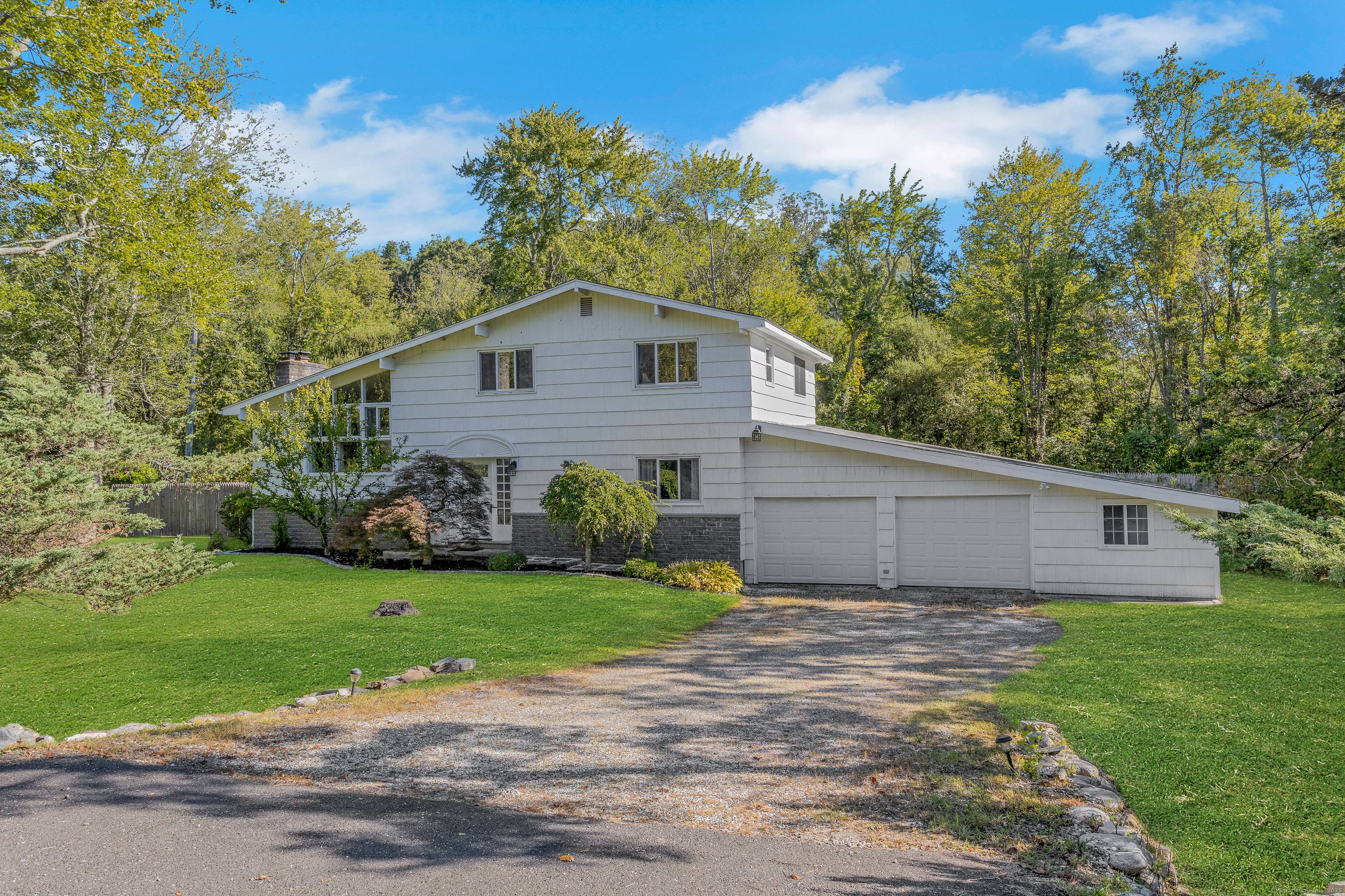 Move In Ready Contemporary Split Level offering a versatile layout for multigenerational use and entertaining.