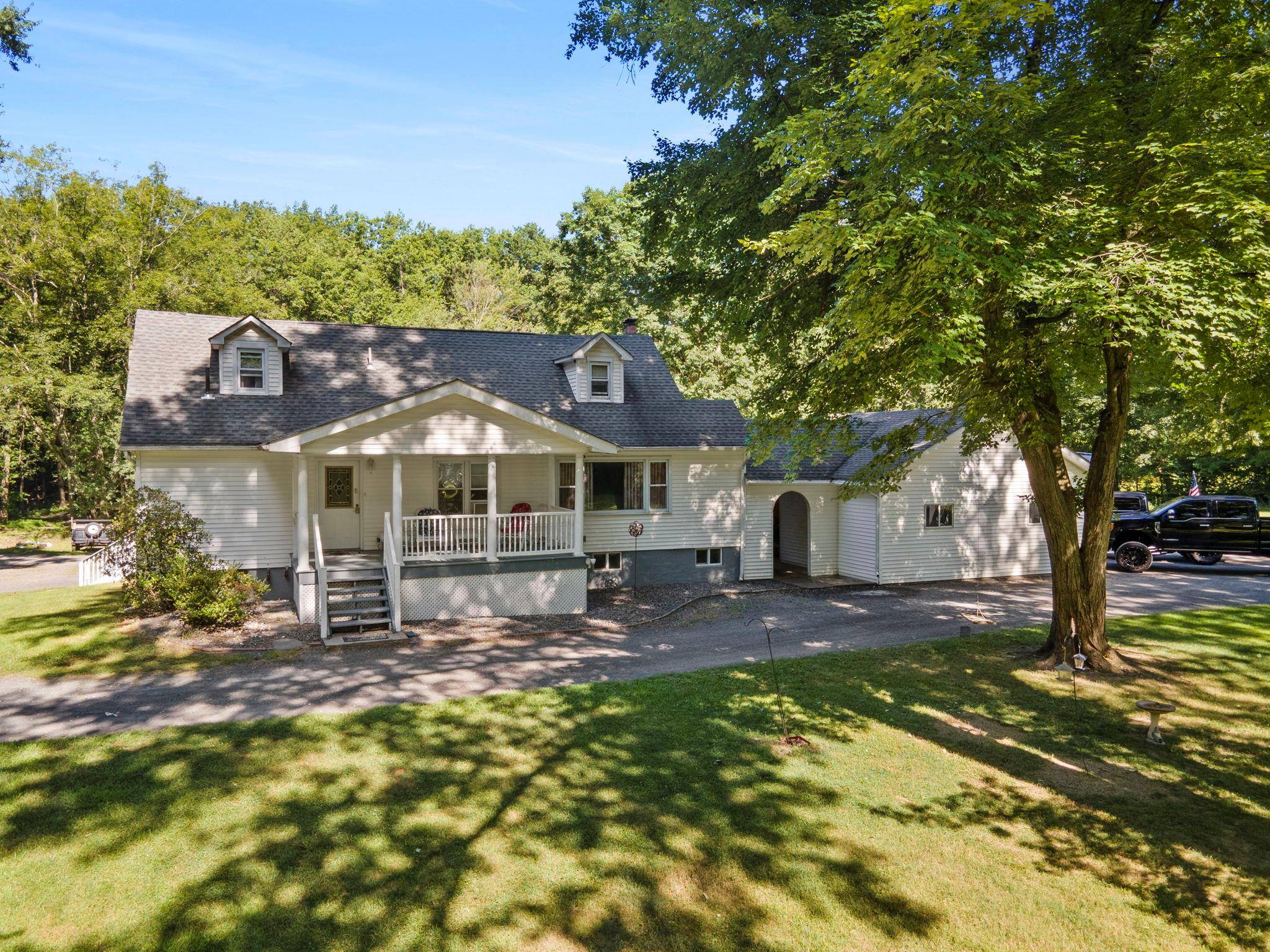 Welcome to this unique and versatile Mother Daughter two family home, nestled on 2.