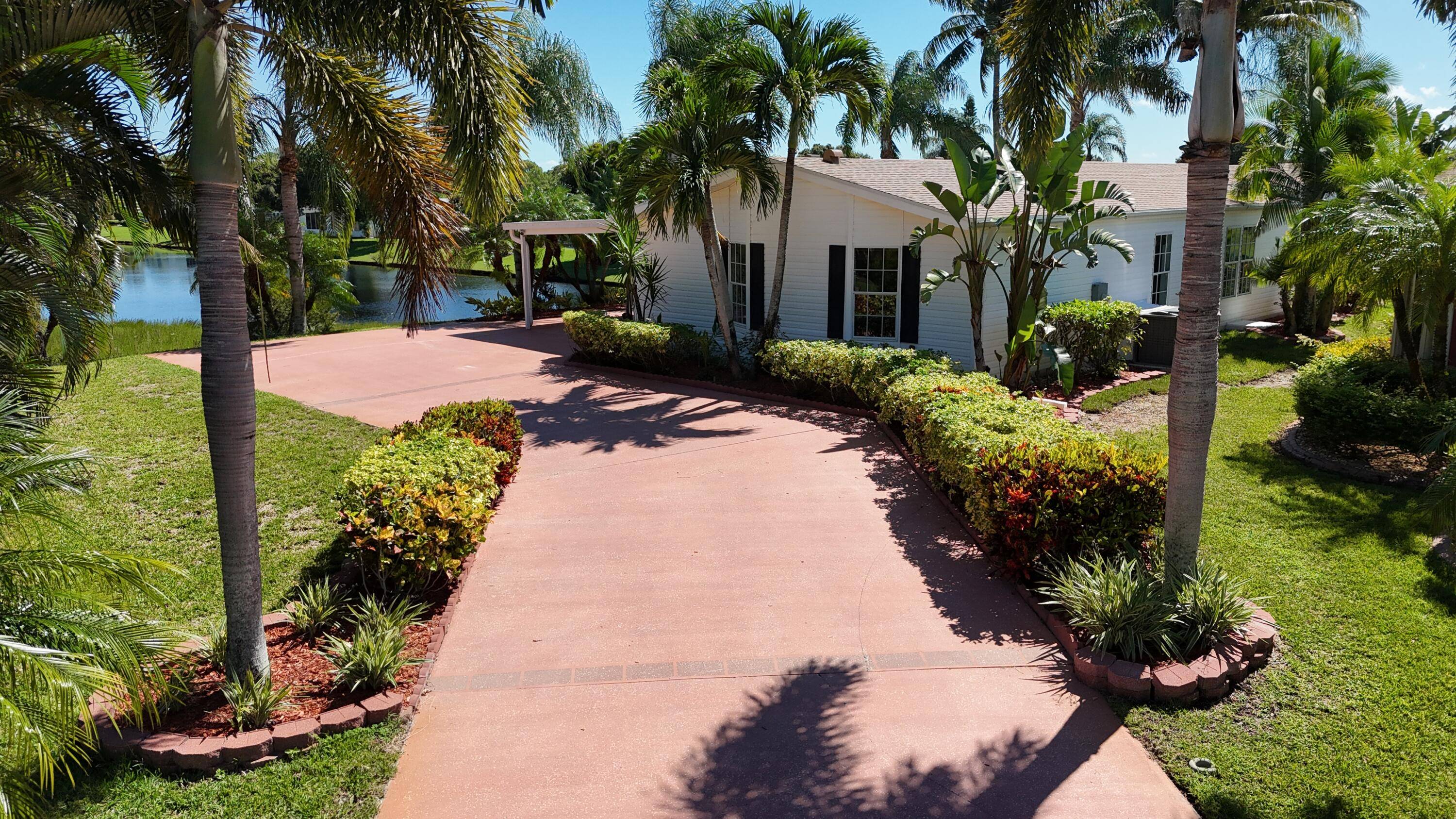 Absolutely stunning and one of a kind corner lot with wraparound water and golf course views from nearly every room !