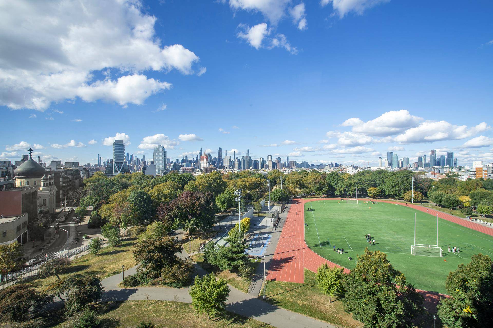 This 9th floor three bedroom two bathroom apartment floats over McCarren Park and is bathed in sunlight with unobstructed and protected Manhattan Skyline views.
