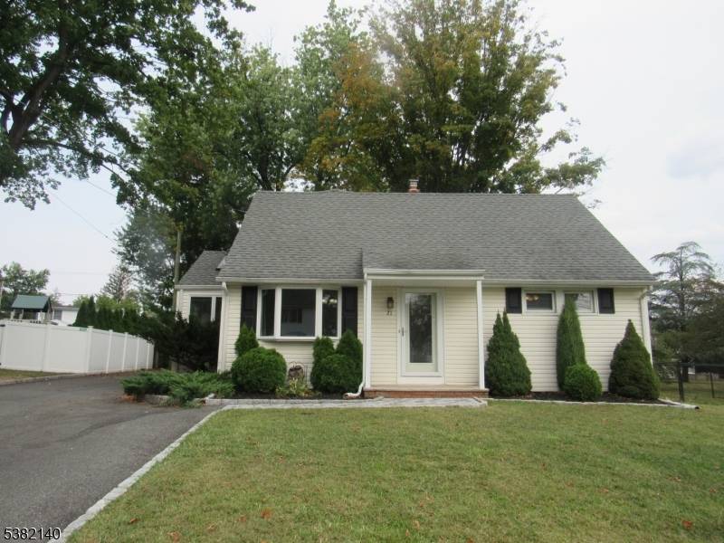 On a peaceful cul de sac, this thoughtfully expanded home offers charm, space, and numerous upgrades throughout.