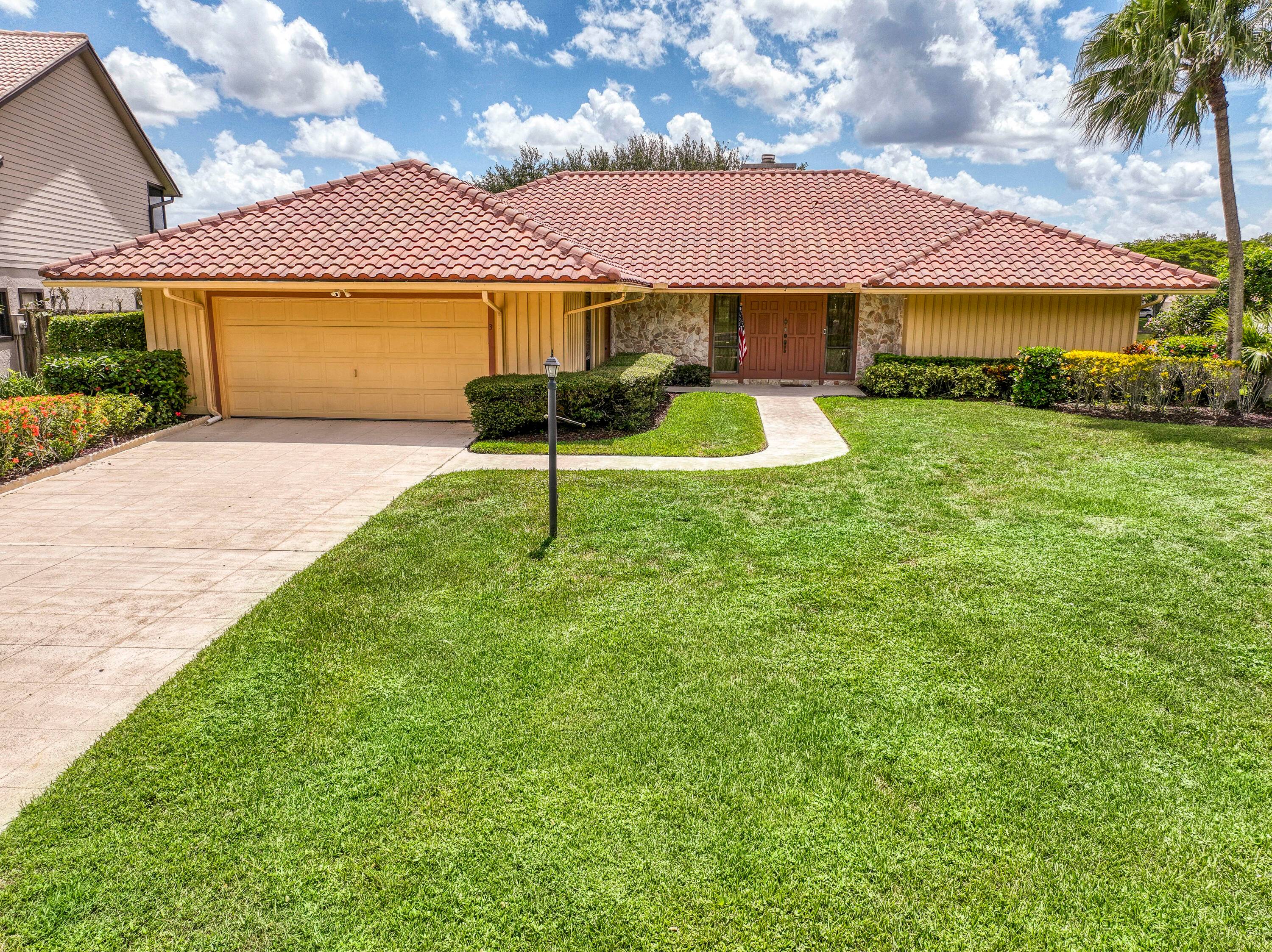 Discover sweeping golf course and lake views at this serene retreat tucked away on a quiet cul de sac in the sought after Glengary community at PGA National.