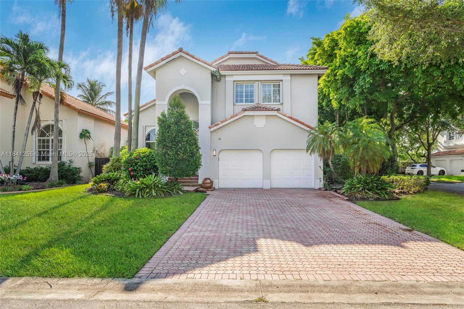Beautiful single family home with a private pool located in the exclusive gated community of Doral Isles.
