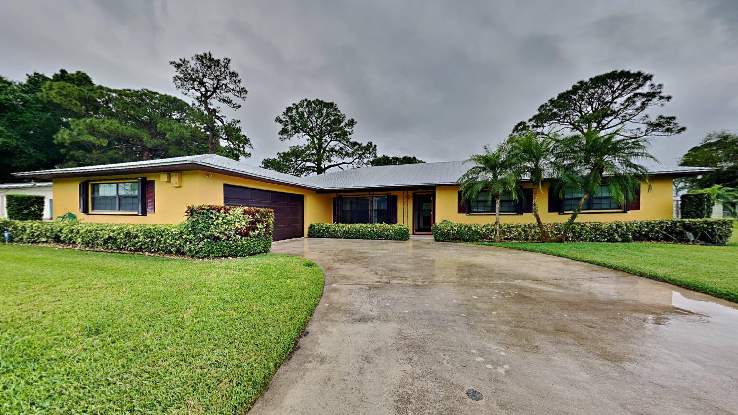This charming 3 bedroom, 2 bath ranch style home offers a spacious open floorplan ideal for entertaining, featuring laminate and tile flooring throughout for easy maintenance and modern appeal.