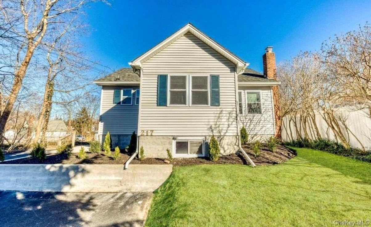 Welcome to 217 Sound Beach Boulevard, a charming Cape Cod style residence located in the serene town of Sound Beach.