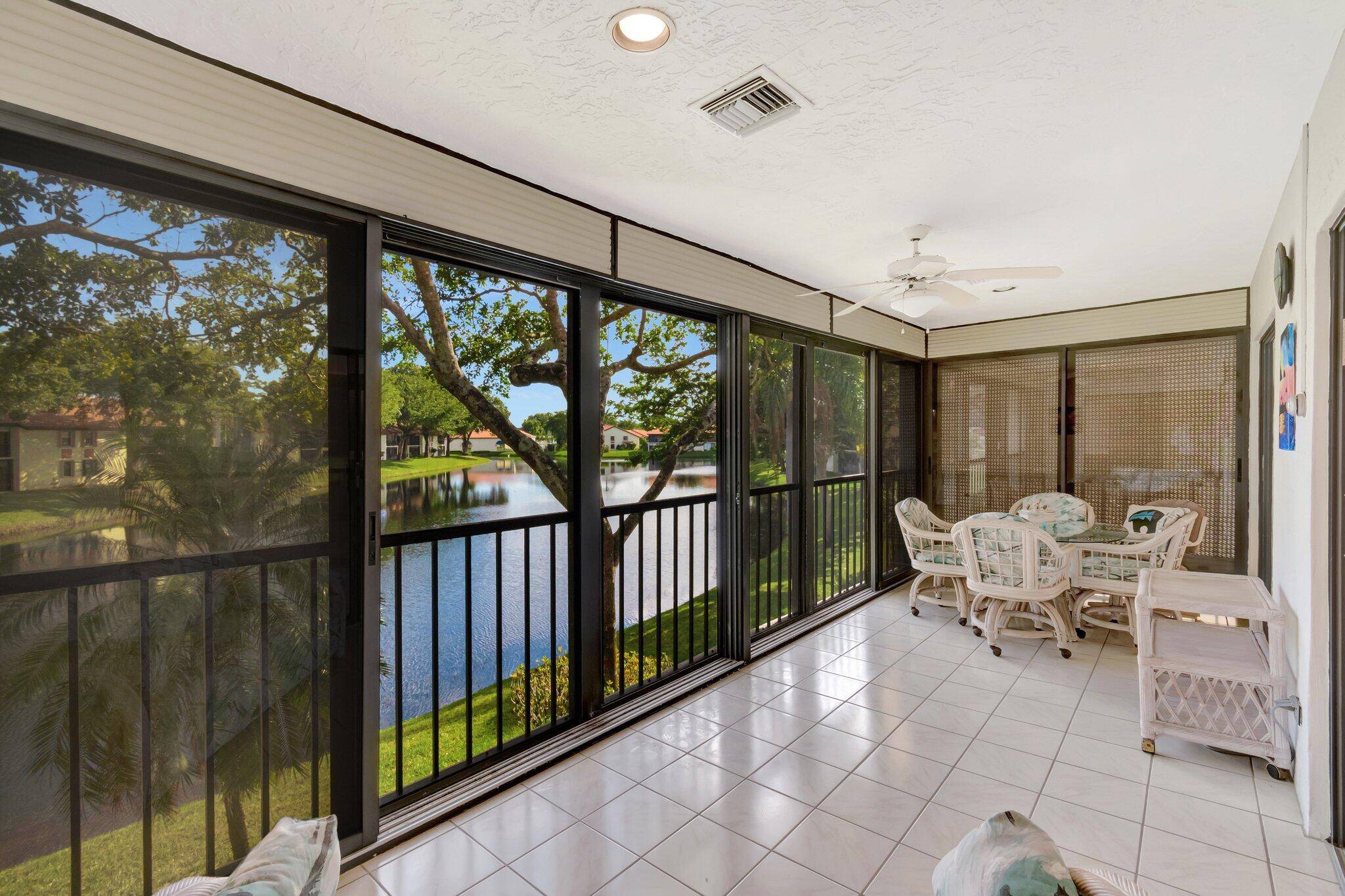 This 2nd floor Corner Unit oasis showcases one of the best Lake Views in Palm Chase.