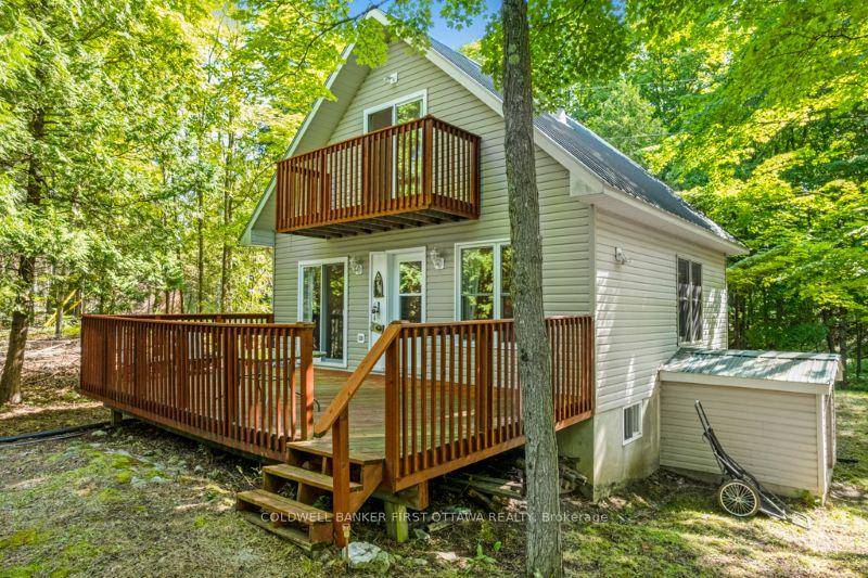 On big beautiful Bobs Lake, welcoming 2003 cottage sheltered by trees, on private 3.