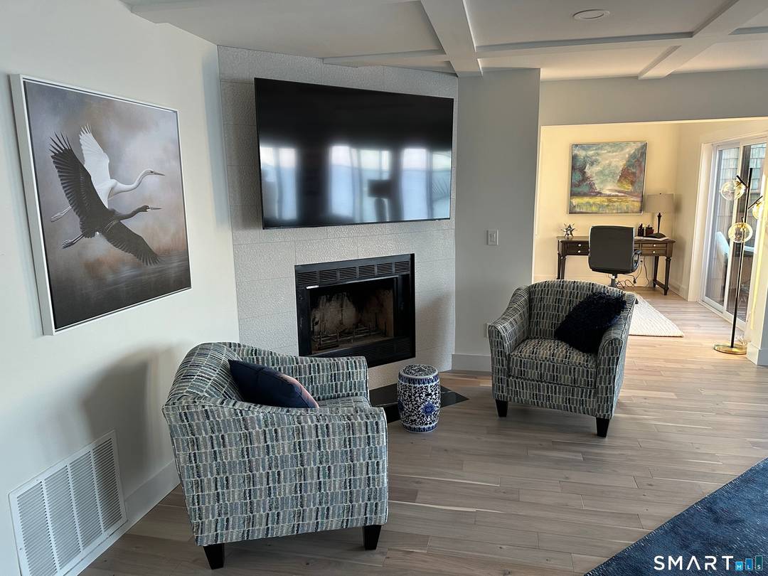 Experience the pinnacle of Connecticut shoreline luxury in this designer curated waterfront townhouse, perfectly positioned in East Haven's most coveted gated community.