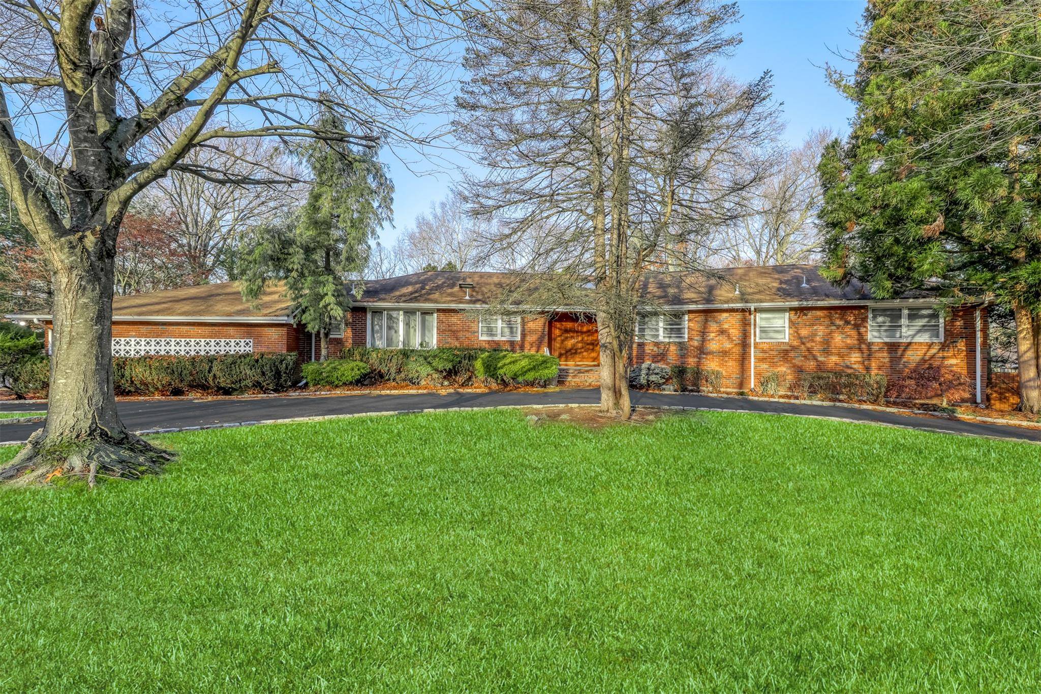This sprawling about 5000 SqFt ranch in Chestnut Ridge presents a wealth of potential, featuring 6 bedrooms and 5 bathrooms across two levels.