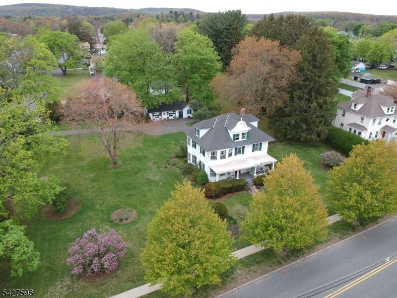 Unique opportunity to own this 116 year old Succasunna colonial on 1 acre corner lot with 2 car detached garage and workshop.