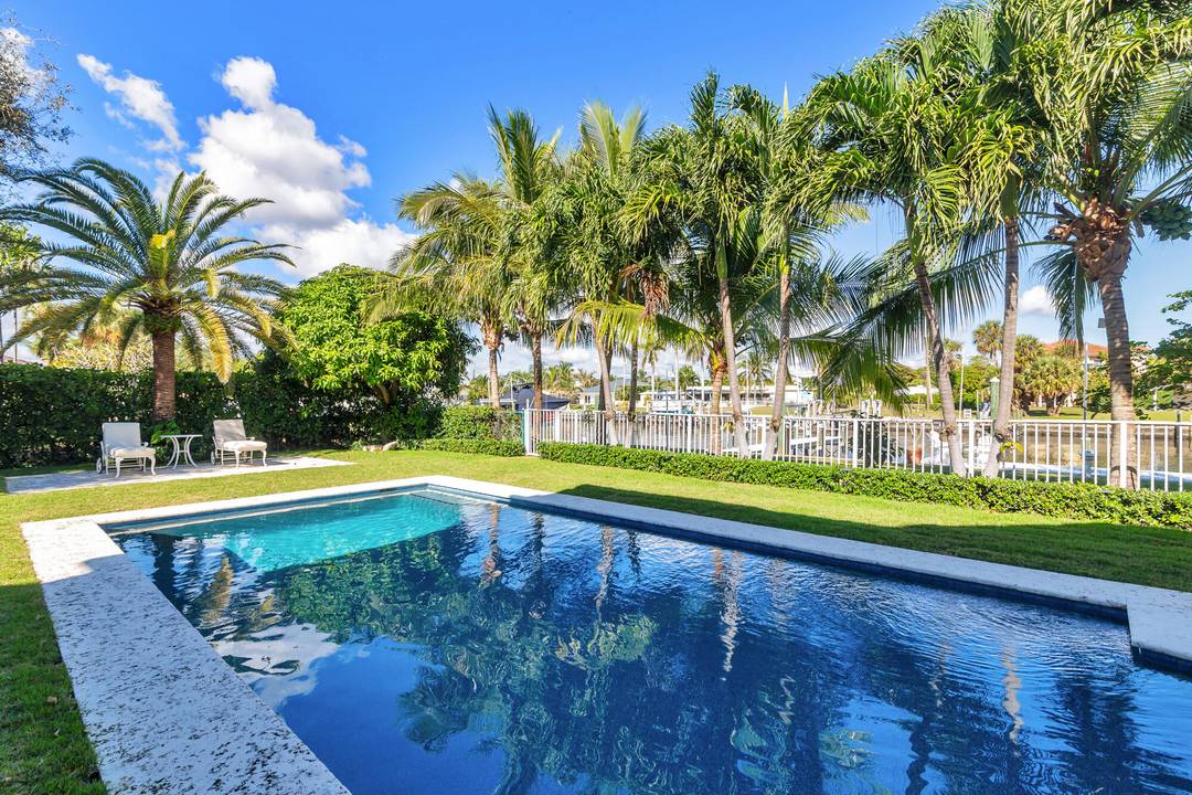 This stunning waterfront property in Lake Worth offers the perfect blend of luxury, privacy, and functionality.
