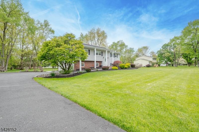 Just unpack ! Nestled on a park like 1 acre lot, this bright and airy 4 bedroom, 2.