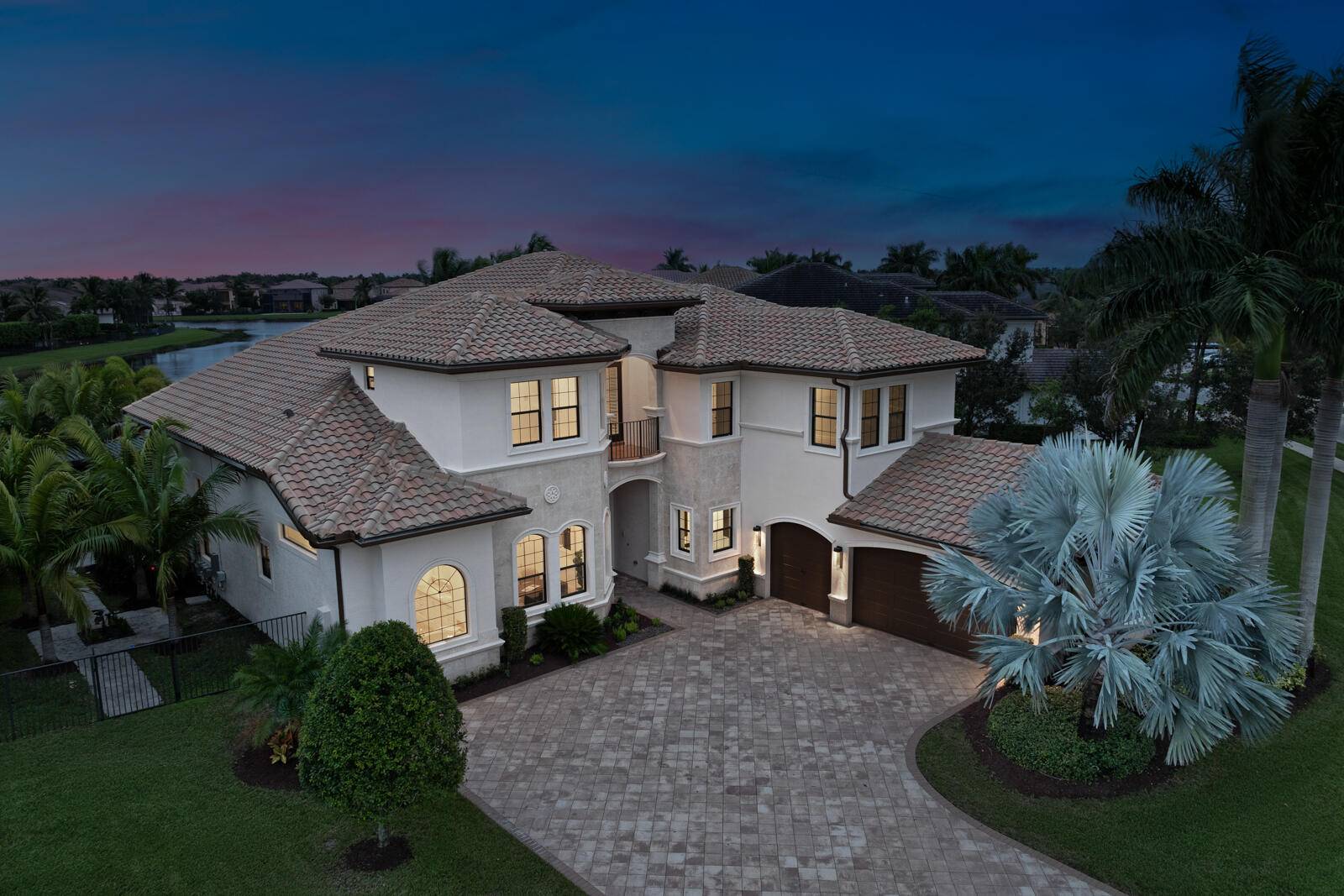 This meticulously crafted transitional styled residence has been reimagined and is prominently positioned on an oversized waterfront lot exceeding a 1 2 acre.