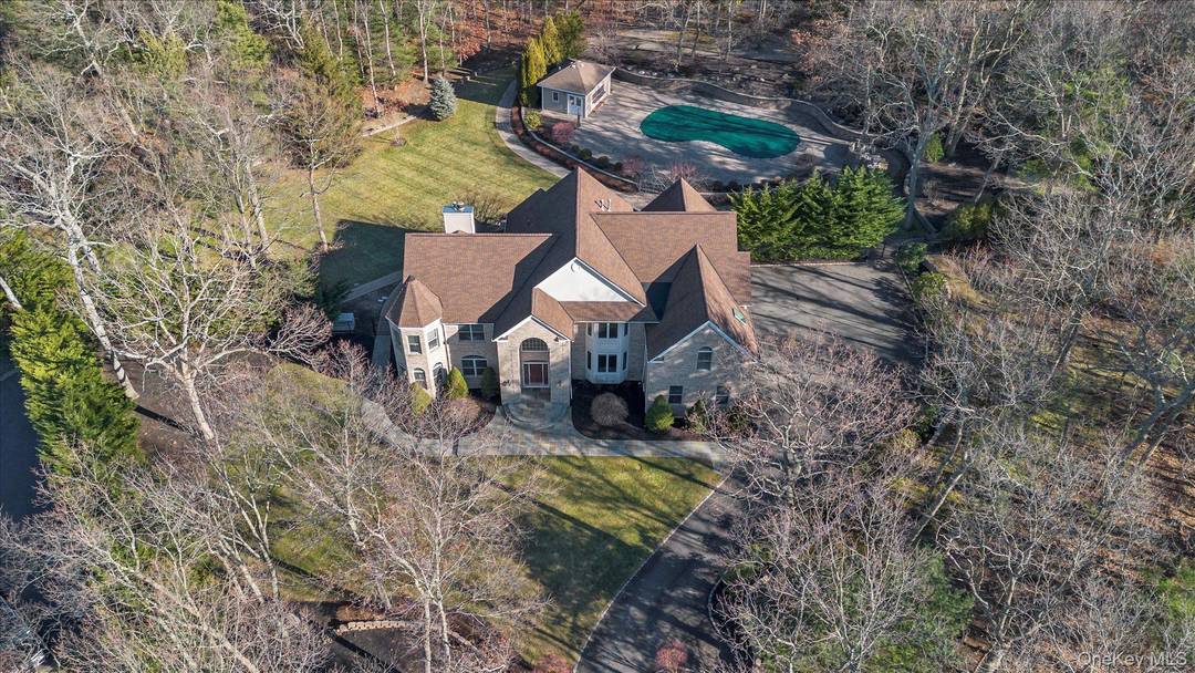 Northport Welcome to this Beautiful, Post Modern Cortez Brick Colonial on a Manicured 2.