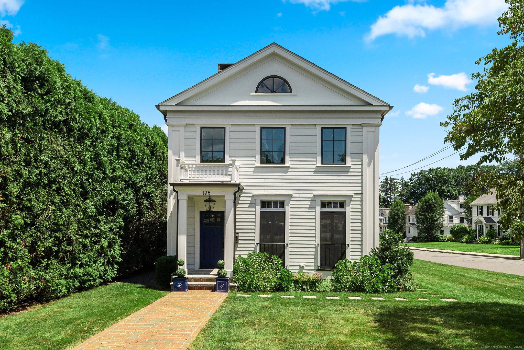 Luxury In Town Living ! Discover timeless elegance and modern ease in this beautiful, fully renovated Colonial home, just steps from the heart of downtown New Canaan.