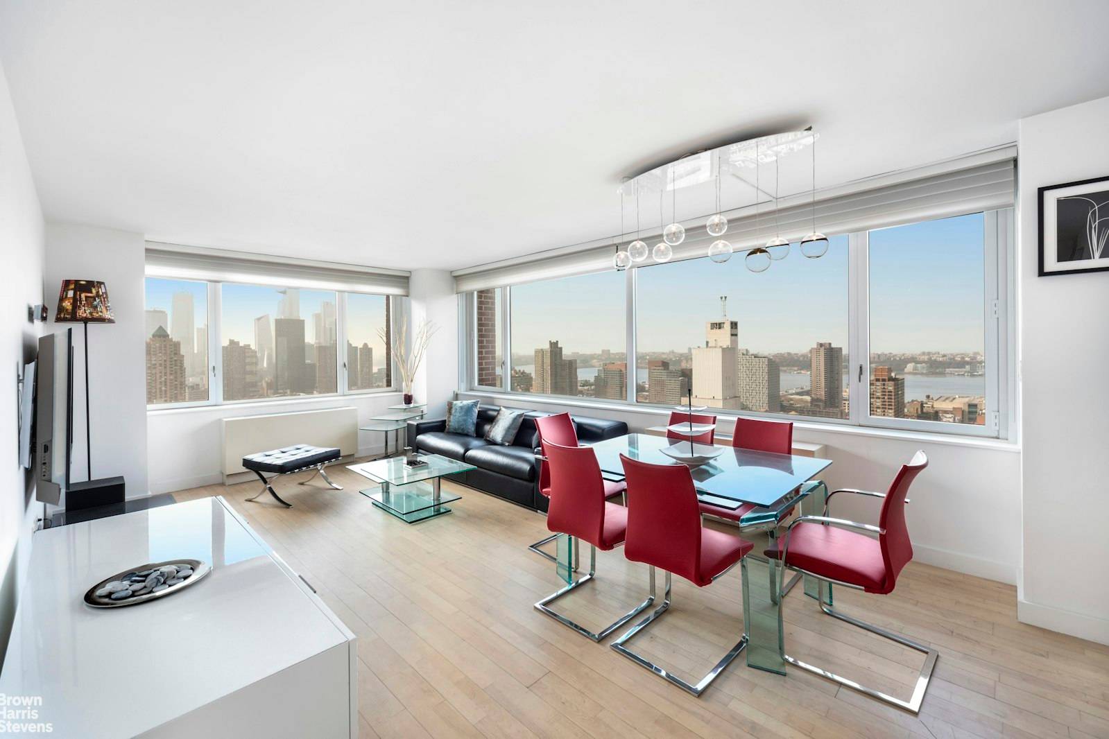Corner windows face the Hudson River and The Statue of Liberty from this new, Contemporary and sleek two bedroom, two bath.