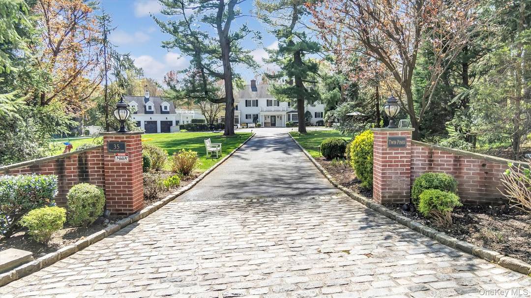 At the end of a long private driveway the exceedingly charming Georgian Colonial aptly styled Twin Pines awaits.